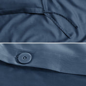 Close-up of a sateen duvet cover with a button and ties