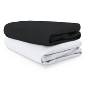 2 crib fitted sheets folded and stacked