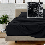 Close up of sewn in tag and matching sheets on a bed