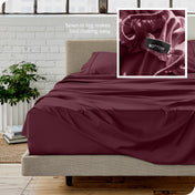 Close up of sewn in tag and matching sheets on a bed