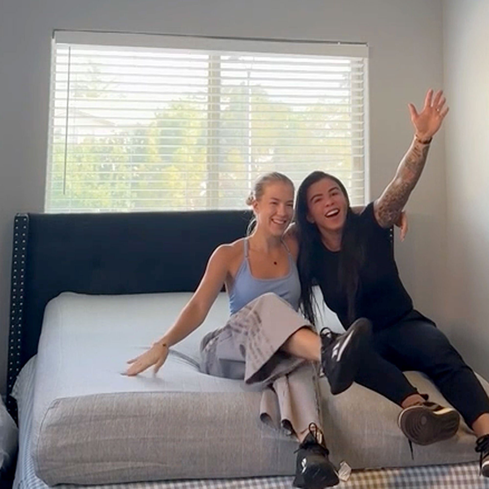 Image of Claudia Gadelha, former UFC Fighter on her airbnb mattress