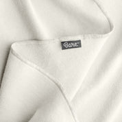 Up close image flannel receiving blanket showing tag