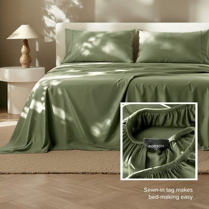 Sheets on a bed with a close-up of the fitted sheet showing a sewn-in tag.