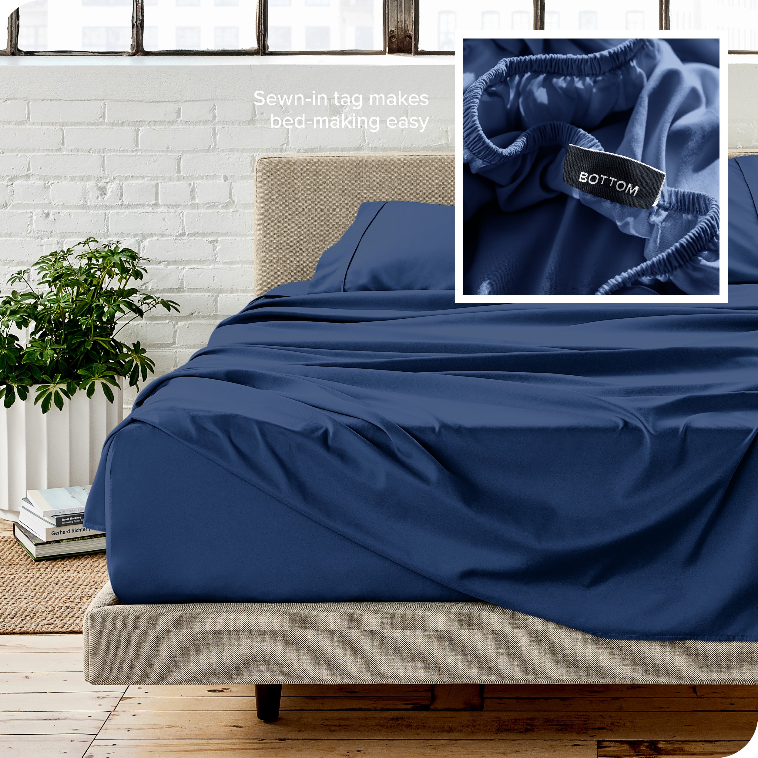 Close up of sewn in tag and matching sheets on a bed