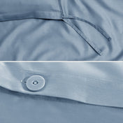 Close-up of a sateen duvet cover with a button and ties