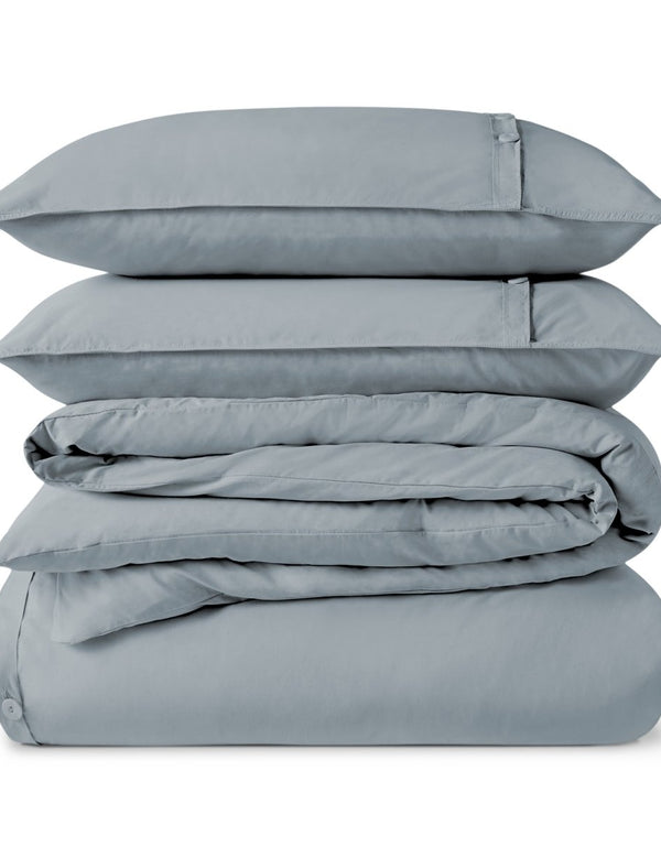 A percale duvet set folded and stacked