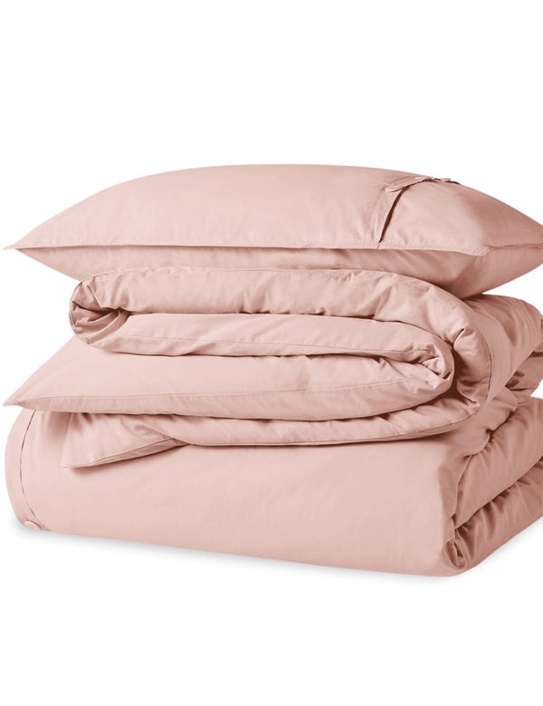 A percale duvet set folded and stacked