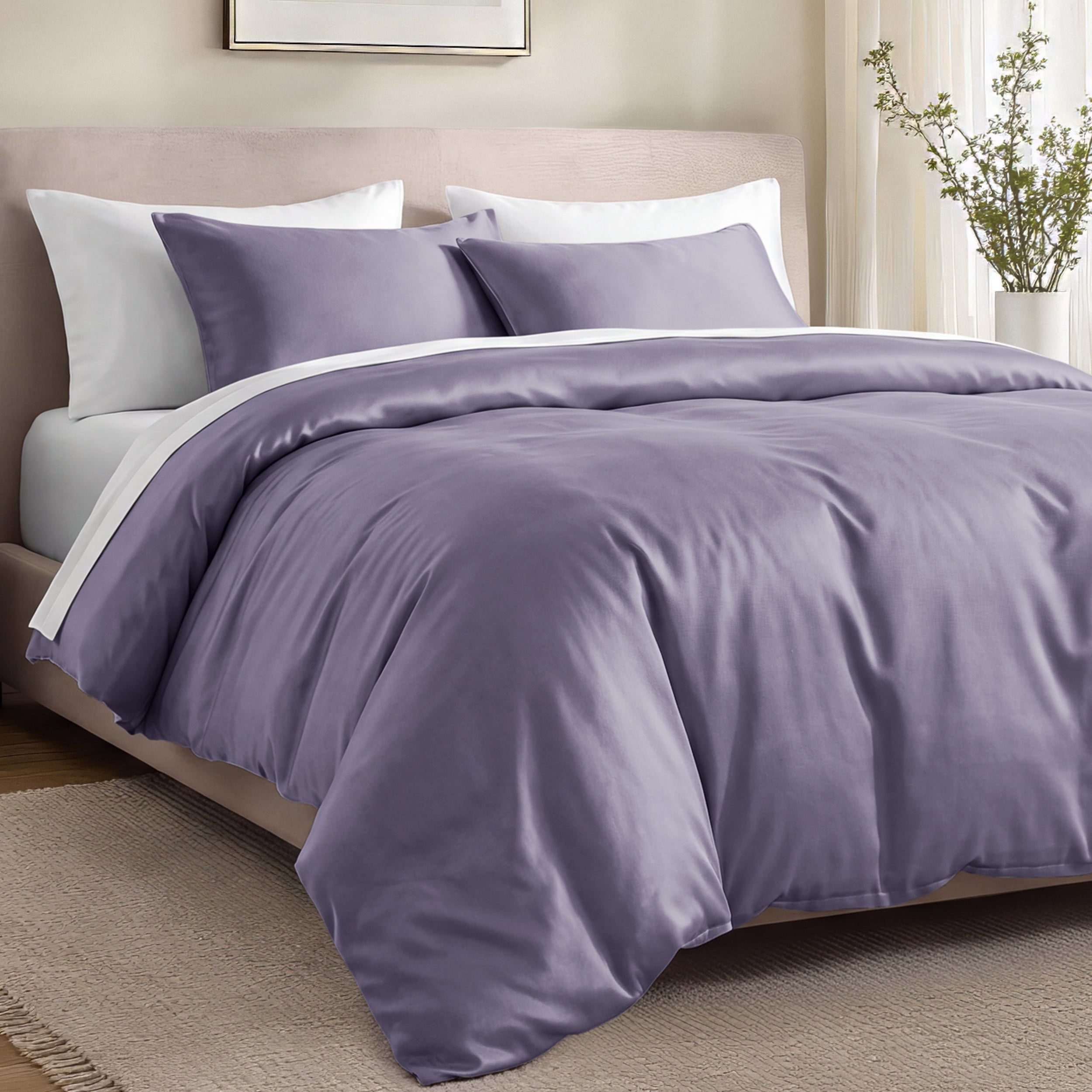 Bed with organic cotton sateen bedding in a bedroom setting.