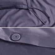 Close-up of a sateen duvet cover with a button and ties