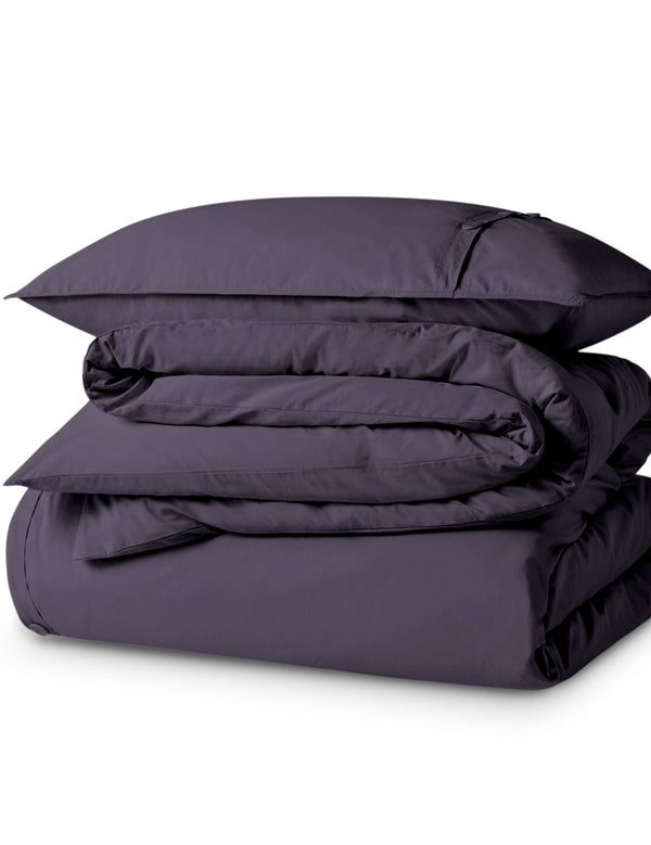 A percale duvet set folded and stacked