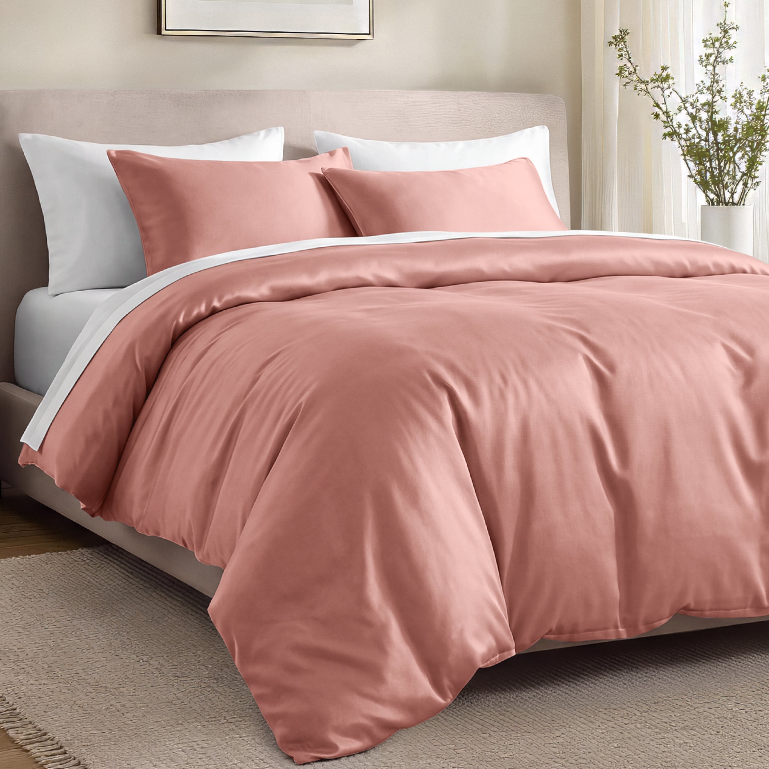Bed with organic cotton sateen bedding in a bedroom setting.