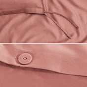 Close-up of a sateen duvet cover with a button and ties