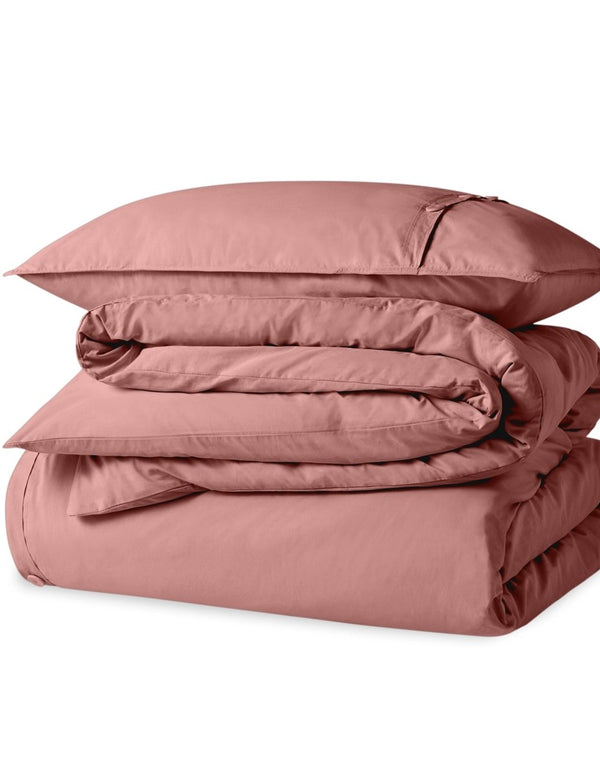 A percale duvet set folded and stacked