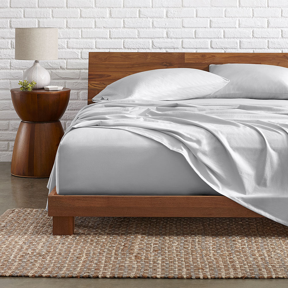 Organic Sheet Set Made oNn a wooden bed frame