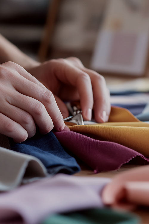 Woman sewing fabric Sheets