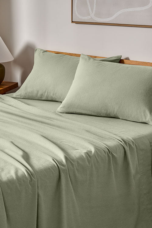 Sage Flannel Sheets in Clean Designed Room