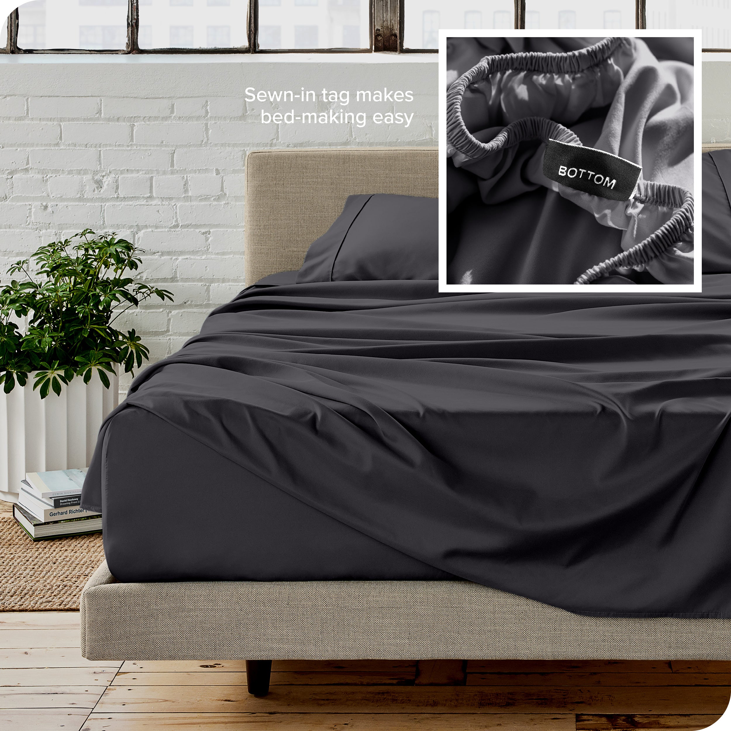 Close up of sewn in tag and matching sheets on a bed