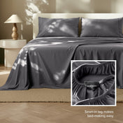 Sheets on a bed with a close-up of the fitted sheet showing a sewn-in tag.