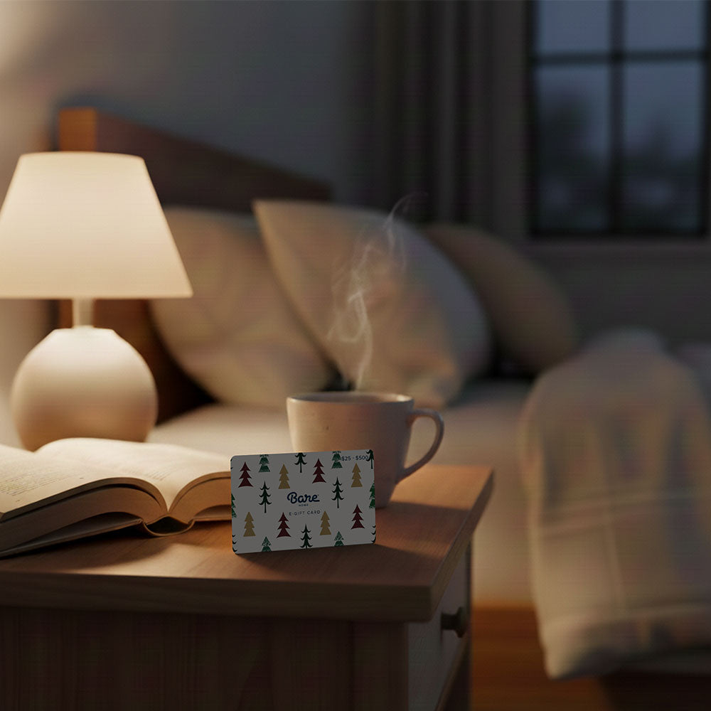 Gift Card on a end table next to a bed