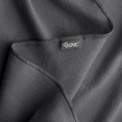 Up close image flannel receiving blanket showing tag