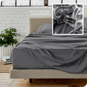 Close up of sewn in tag and matching sheets on a bed