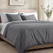 Bed with organic cotton sateen bedding in a bedroom setting.