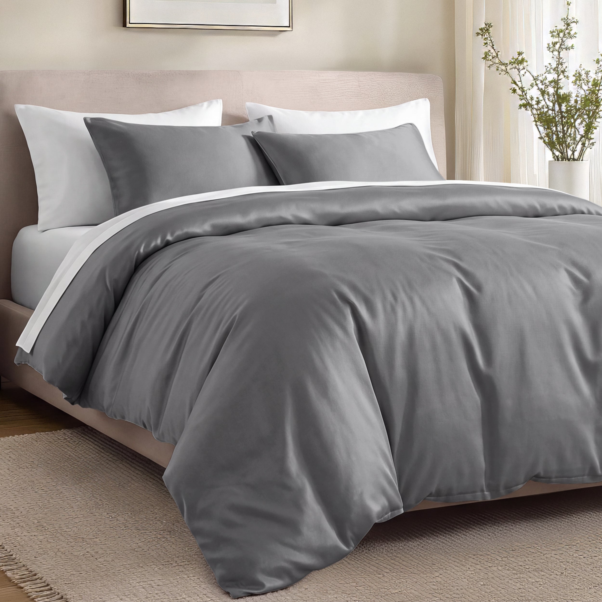 Bed with organic cotton sateen bedding in a bedroom setting.