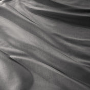 Close-up of a sateen duvet cover with a button and ties
