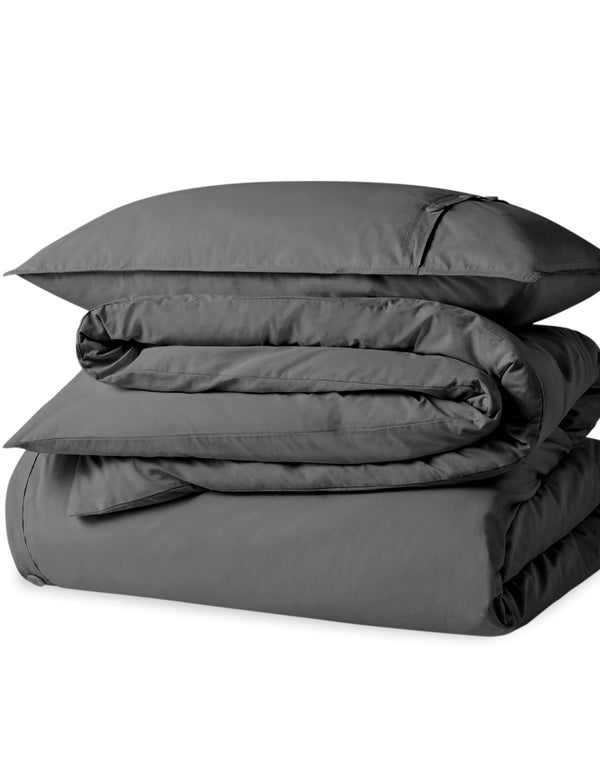 A percale duvet set folded and stacked