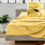 Close up of sewn in tag and matching sheets on a bed