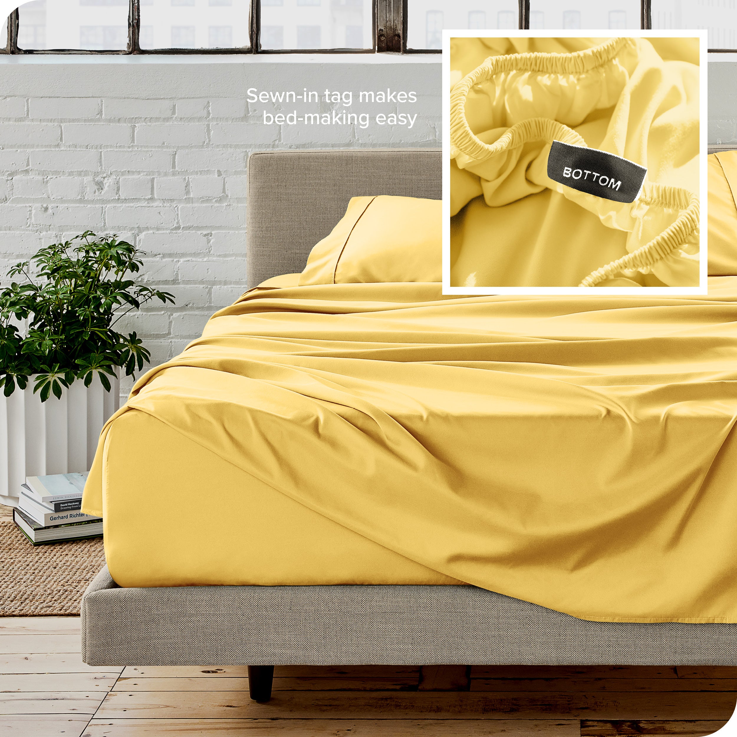 Close up of sewn in tag and matching sheets on a bed