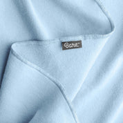 Up close image flannel receiving blanket showing tag