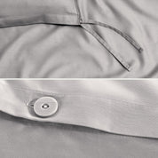 Close-up of a sateen duvet cover with a button and ties