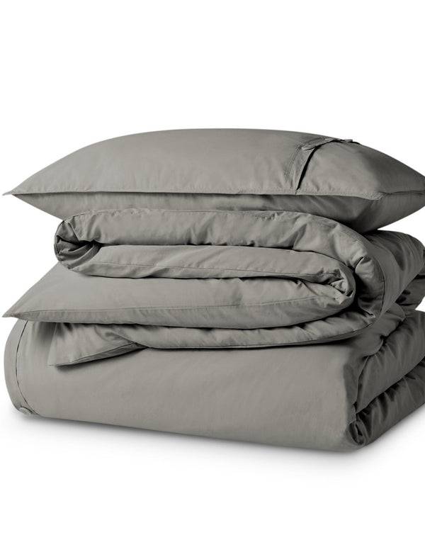 A percale duvet set folded and stacked