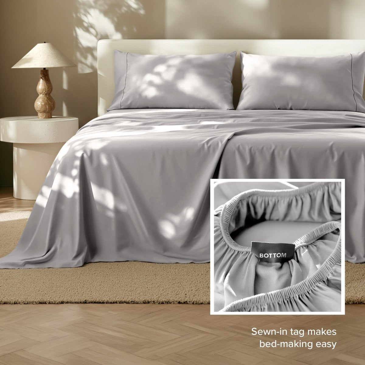 Sheets on a bed with a close-up of the fitted sheet showing a sewn-in tag.