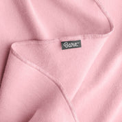 Up close image flannel receiving blanket showing tag