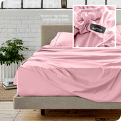 Close up of sewn in tag and matching sheets on a bed