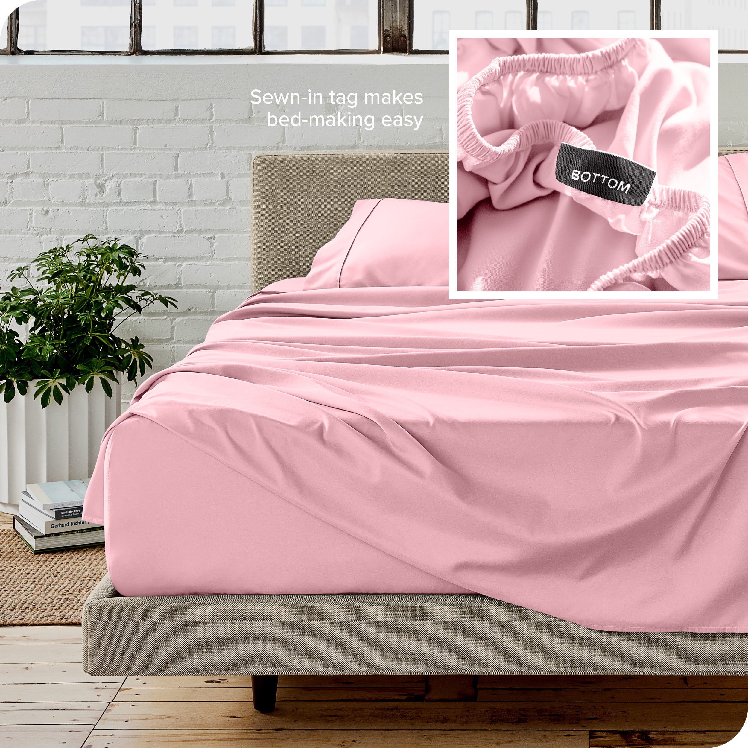 Close up of sewn in tag and matching sheets on a bed