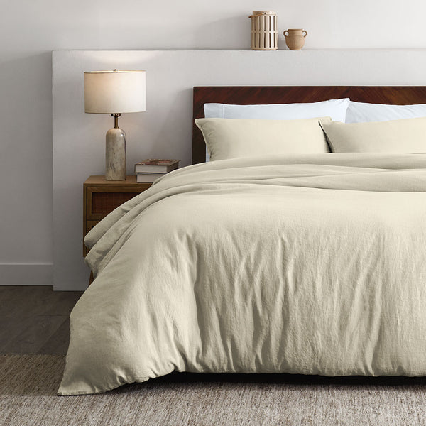 Linen Bed made in cream duvet in white room