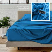 Close up of sewn in tag and matching sheets on a bed