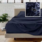 Close up of sewn in tag and matching sheets on a bed