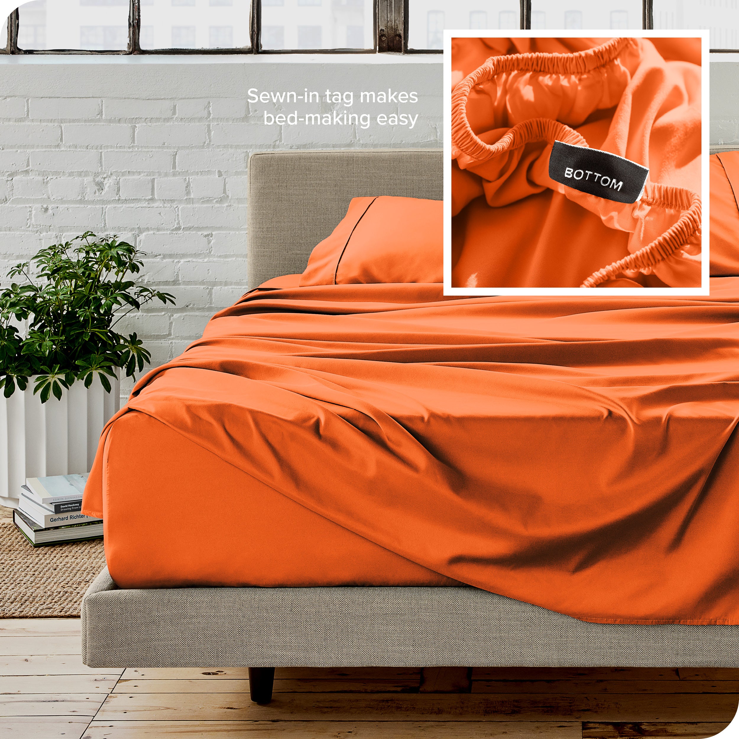 Close up of sewn in tag and matching sheets on a bed