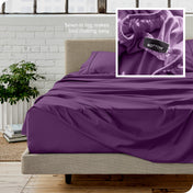 Close up of sewn in tag and matching sheets on a bed