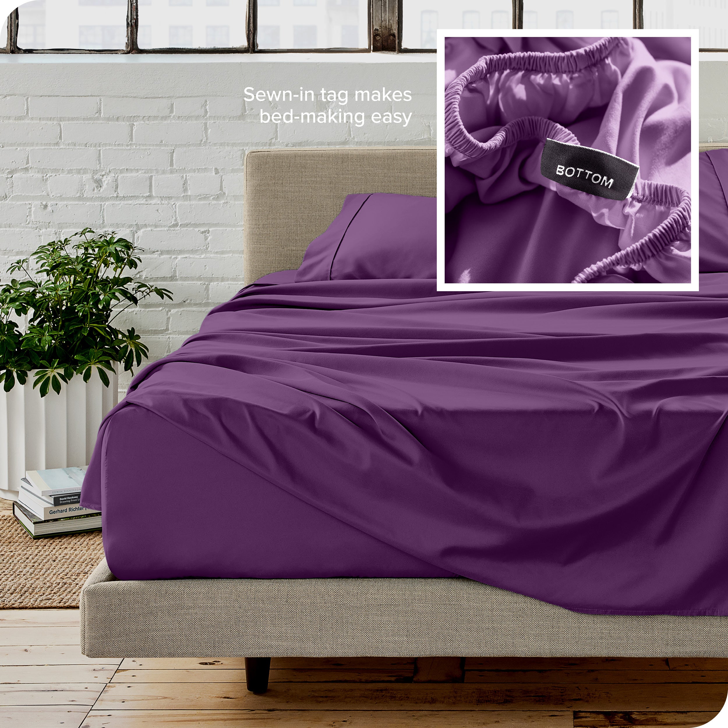 Close up of sewn in tag and matching sheets on a bed