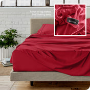 Close up of sewn in tag and matching sheets on a bed