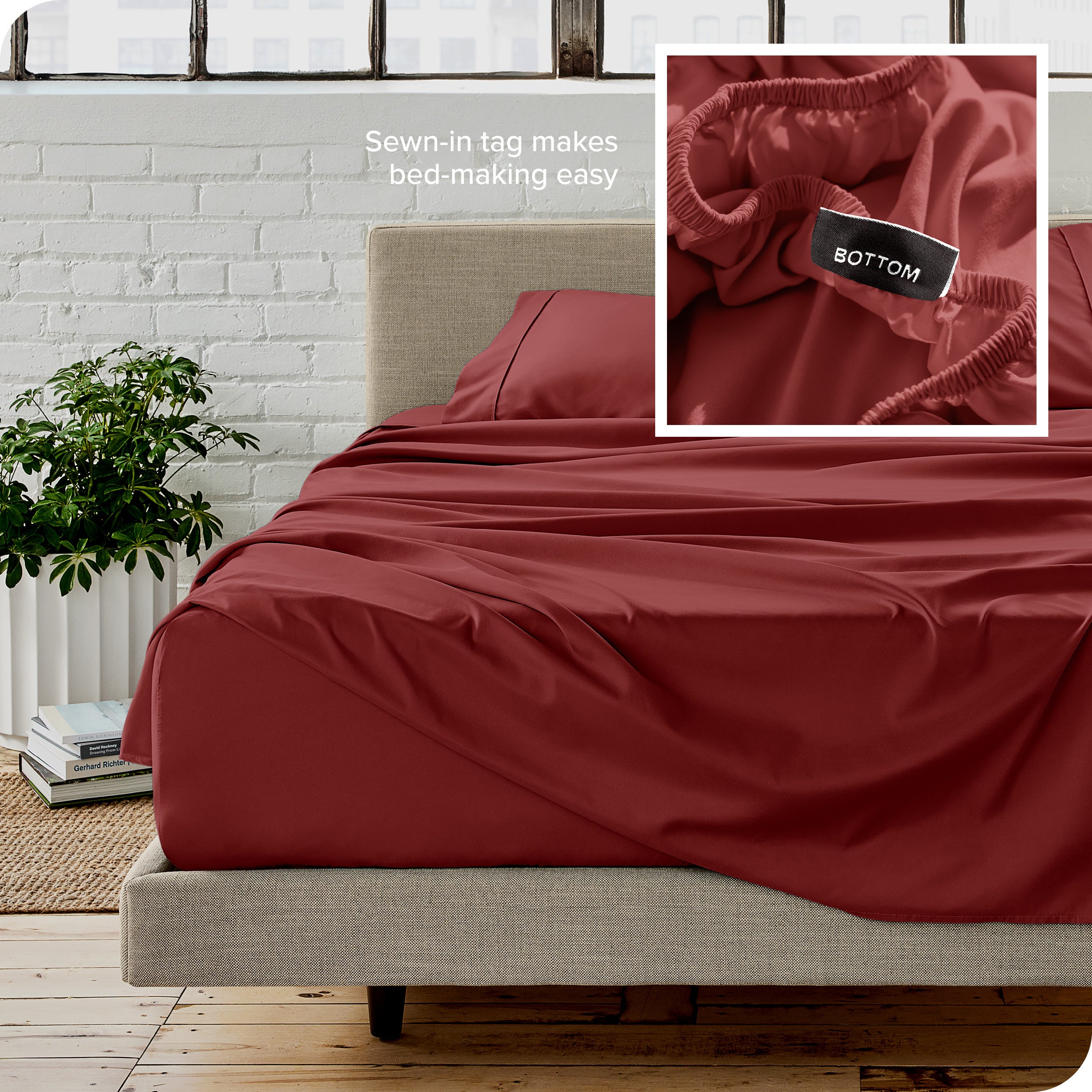 Close up of sewn in tag and matching sheets on a bed