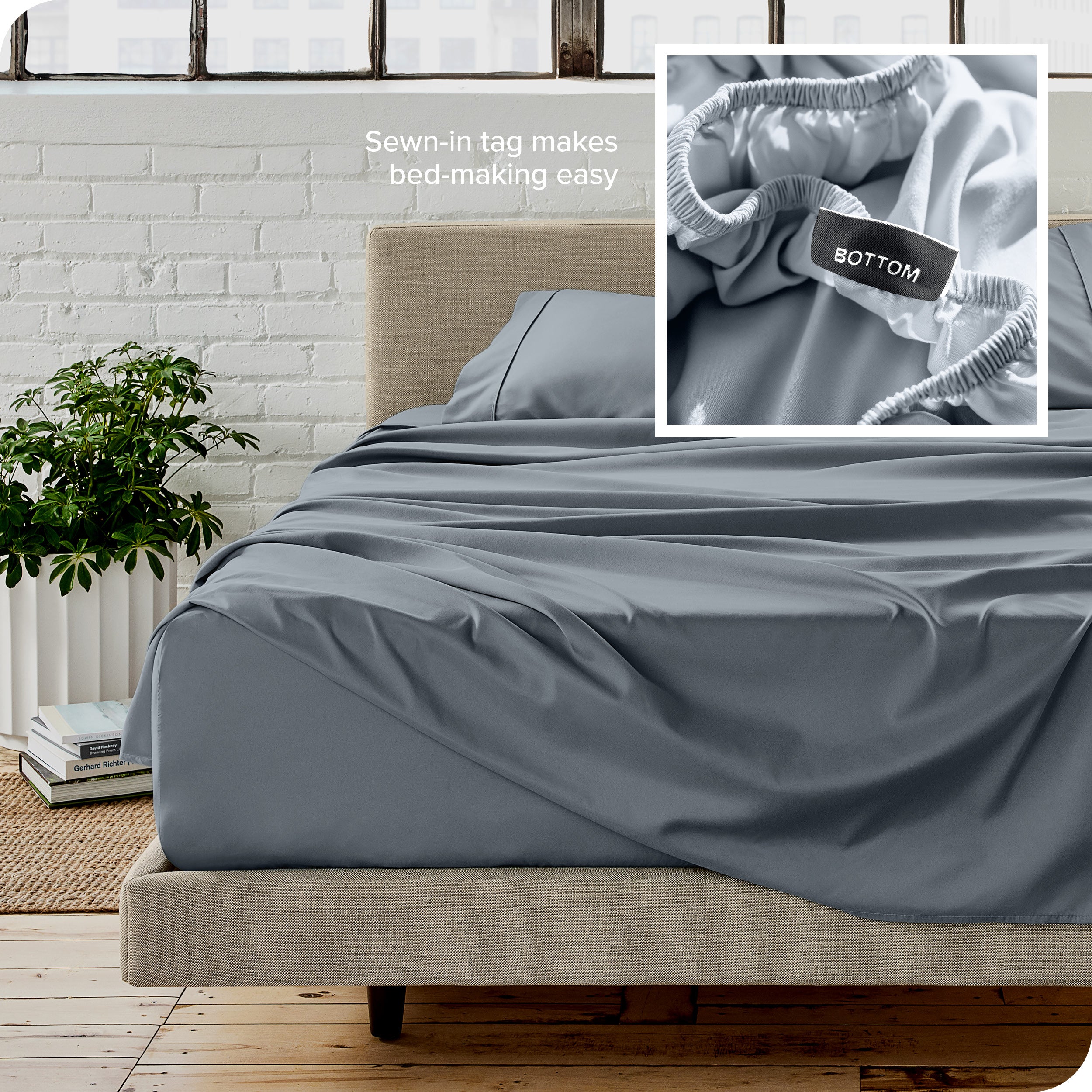 Close up of sewn in tag and matching sheets on a bed