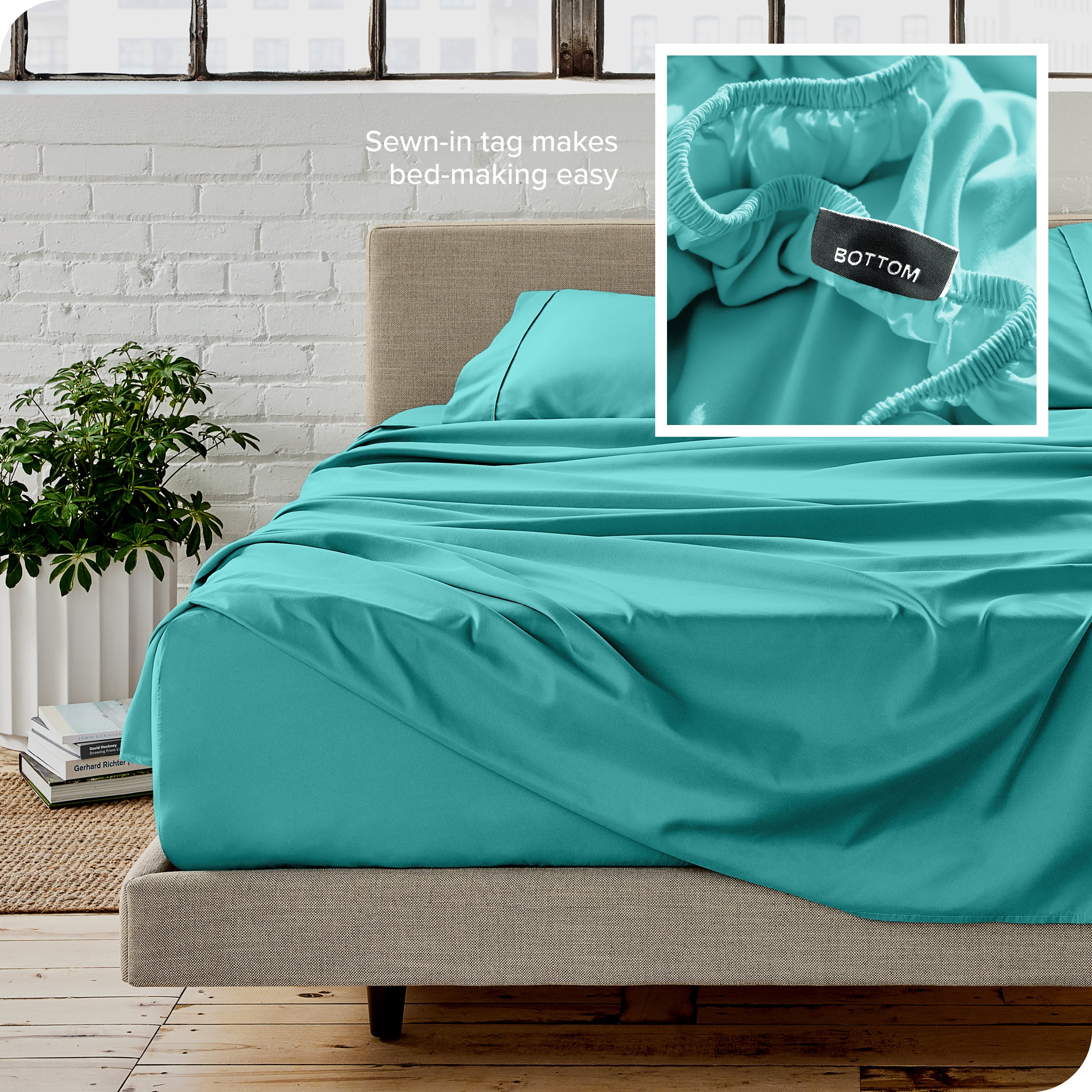 Close up of sewn in tag and matching sheets on a bed