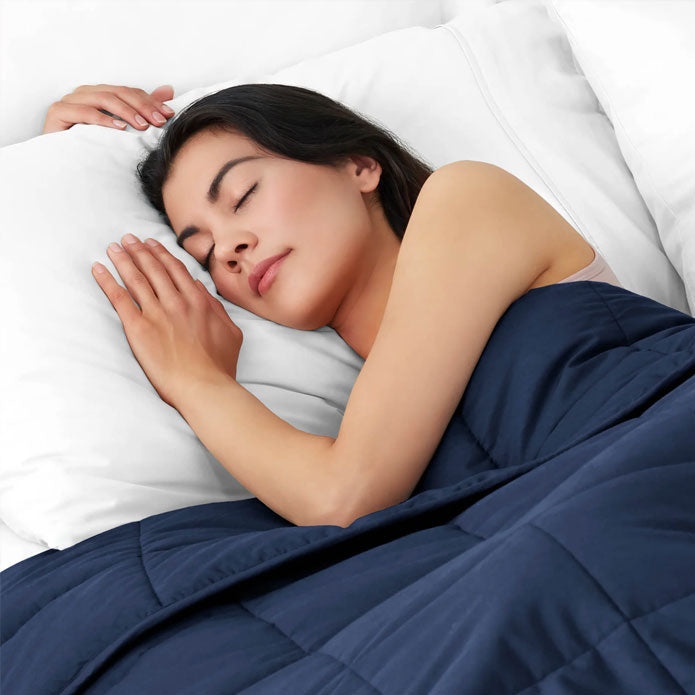 Woman sleeping with a weighted blamket