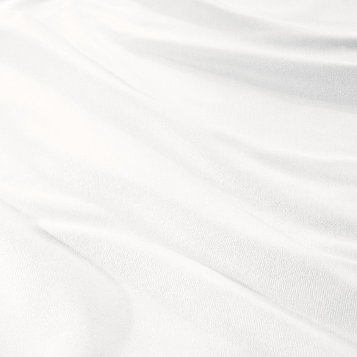 Close-up of a sateen duvet cover with a button and ties